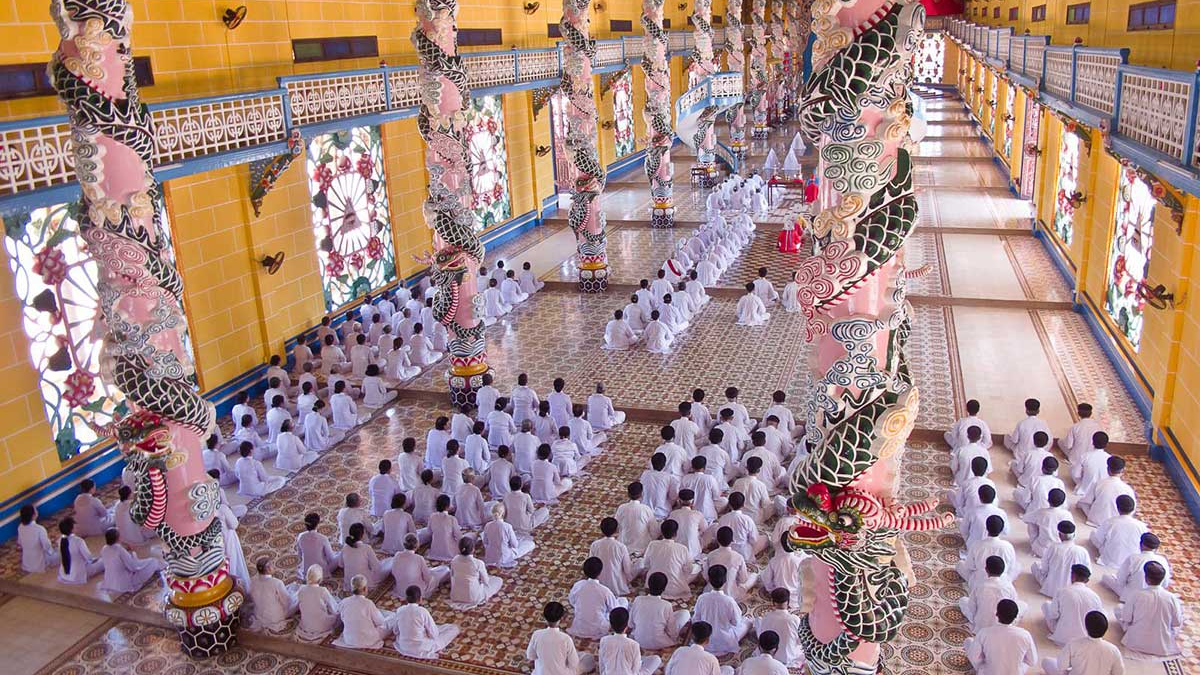 Cao Dai performing ritual prayers